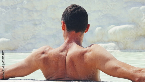 Man Enjoying Water in thermal spring at Pamukkale, Turkey.