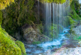 dreimühlen waterfall in the german Eifel with rocks overgrown with moss