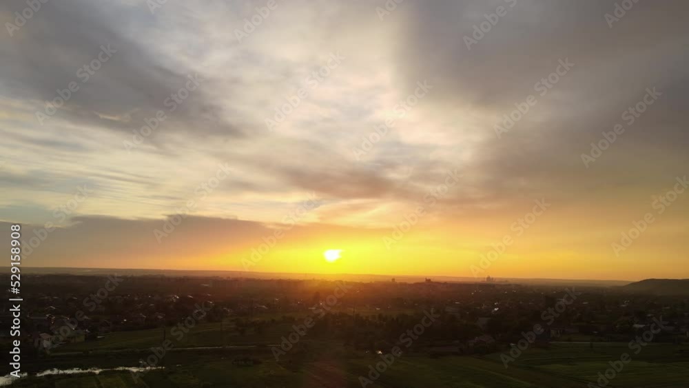 Aerial view of residential houses in suburban rural area at sunset Aerial view of residential houses in suburban rural area at sunset