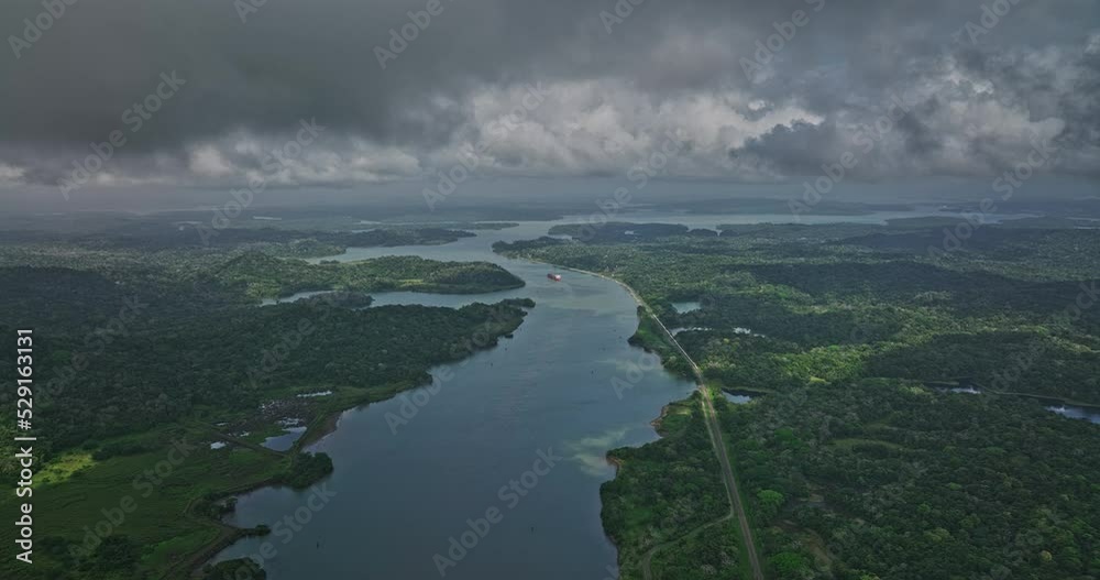 Panama Canal Aerial v1 high flyover gamboa area capturing landscape of chagres river leading to gatun lake with heavy tropical storm clouds in the sky - Shot with Mavic 3 Cine - April 2022