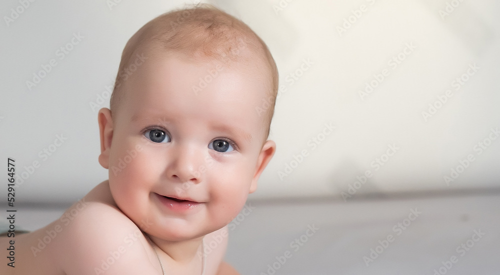 Cute smiling baby on a gray couch Cute smiling baby on a gray couch