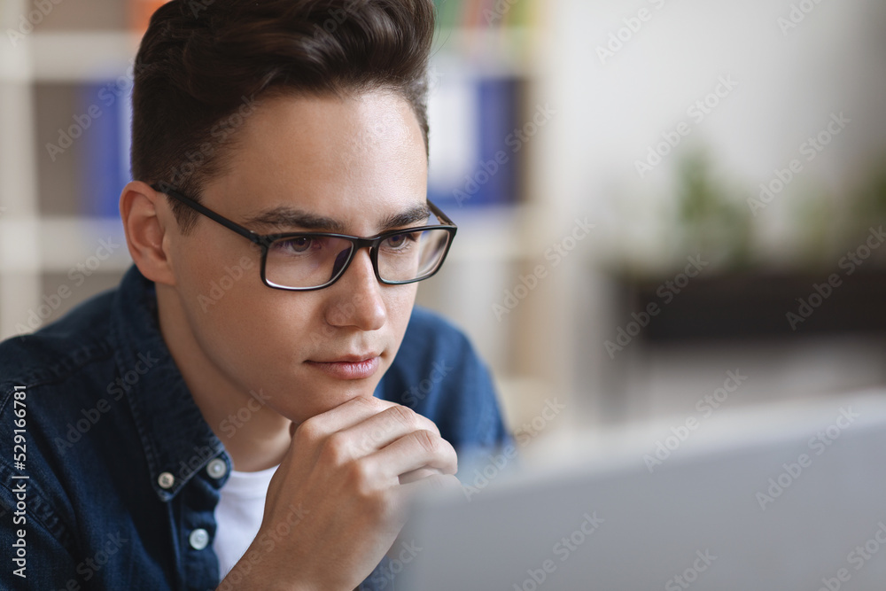Thinking About Solution. Young Businessman In Eyeglasses Looking At Computer Screen, Closeup
