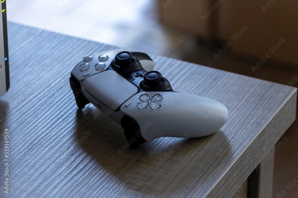 Brecht, Belgium August 12 2022: A portrait of a basic white sony  playstation 5 wireless controller