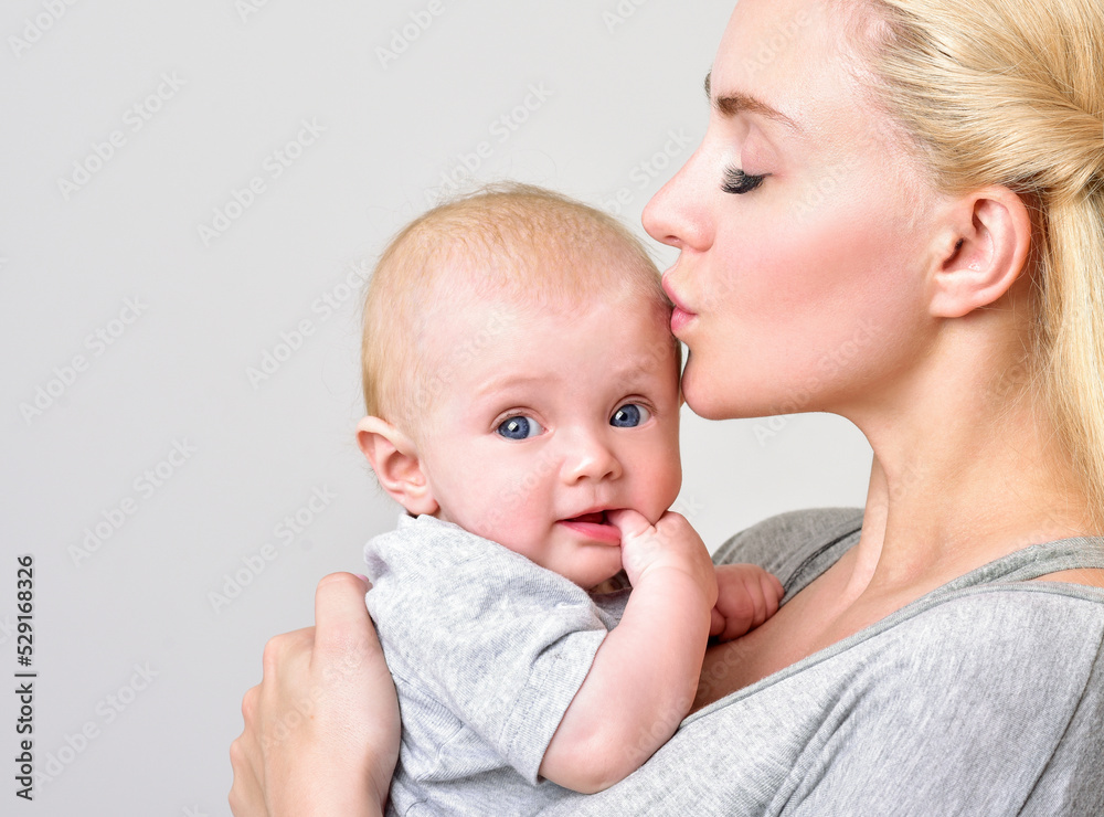 Mother and baby playing and smiling. Happy family. Mother and baby playing and smiling. Happy family.