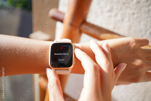 close up of hand holding a watch