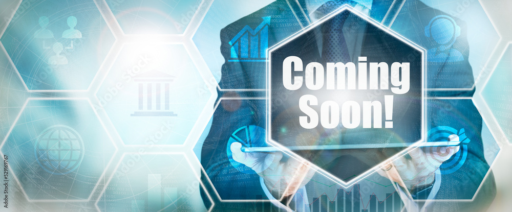 A Coming Soon business word concept on a futuristic blue display.