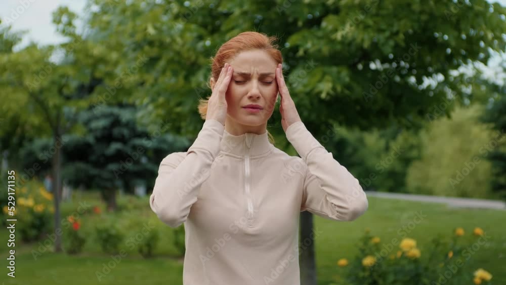 Caucasian woman feeling unhealthy, severe headache, migraine, massage temples. Close-up emotional facial expression view, suffering. Caucasian woman feeling unhealthy, severe headache, migraine, massage temples. Close-up emotional facial expression view, suffering.