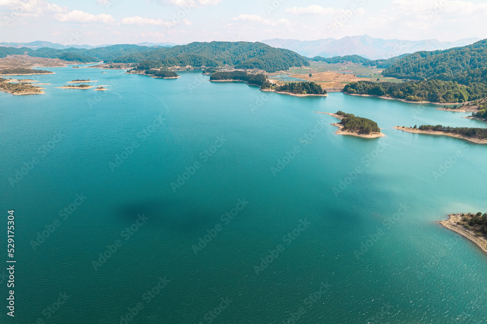 Naklejka premium Aoos Springs Lake in the Metsovo in Epirus. mountains of Pindus in northern Greece. Techniti Limni Aoou Lake. Aerial view, top view, drone