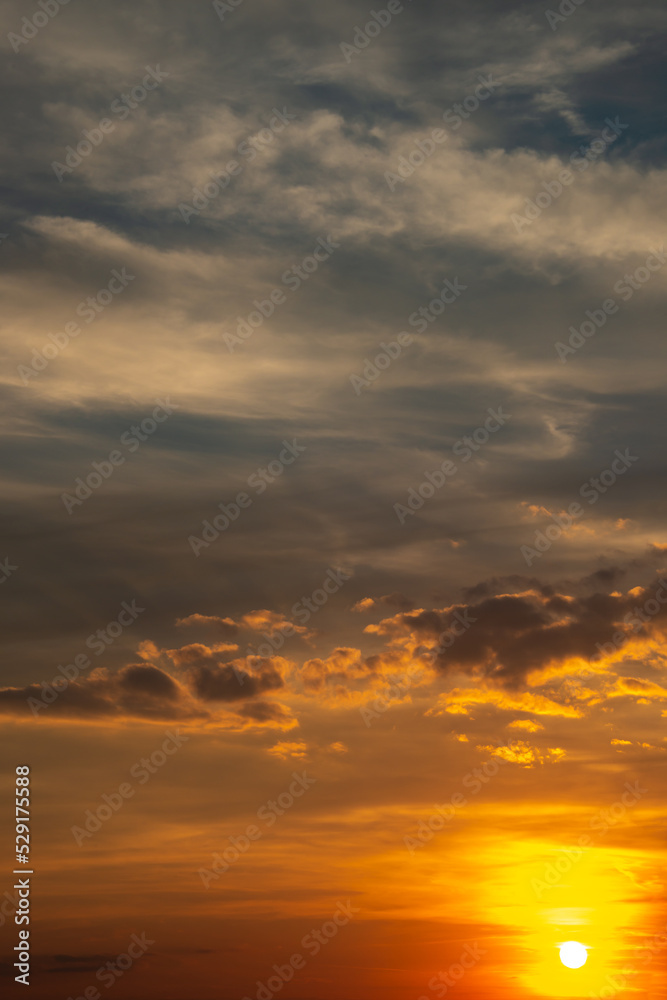 Cover page with deep orange sky, illuminated clouds at bloody sunset as a background.
