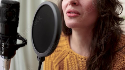 Young woman dubbing voiceover for broadcast stream live show