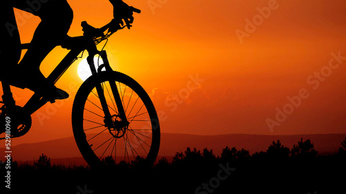 Mountain bike silhouette with beautiful views.