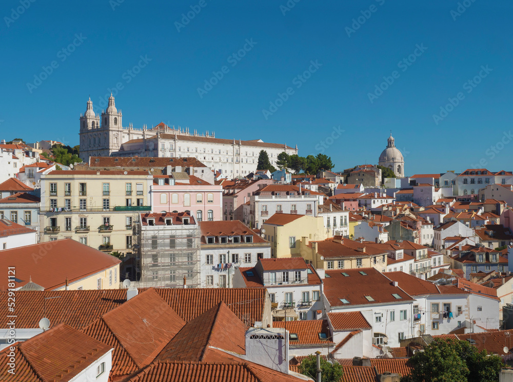 Aerial view of Lisbon skyline, rooftops and tejo river in Portugal seen from the viewpoint called Miradouro das Portas do Sol at Alfama old town district