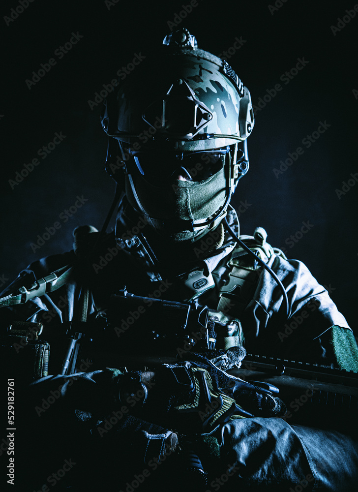 Poster, Foto Army soldier in Protective Combat Uniform holding Special ...