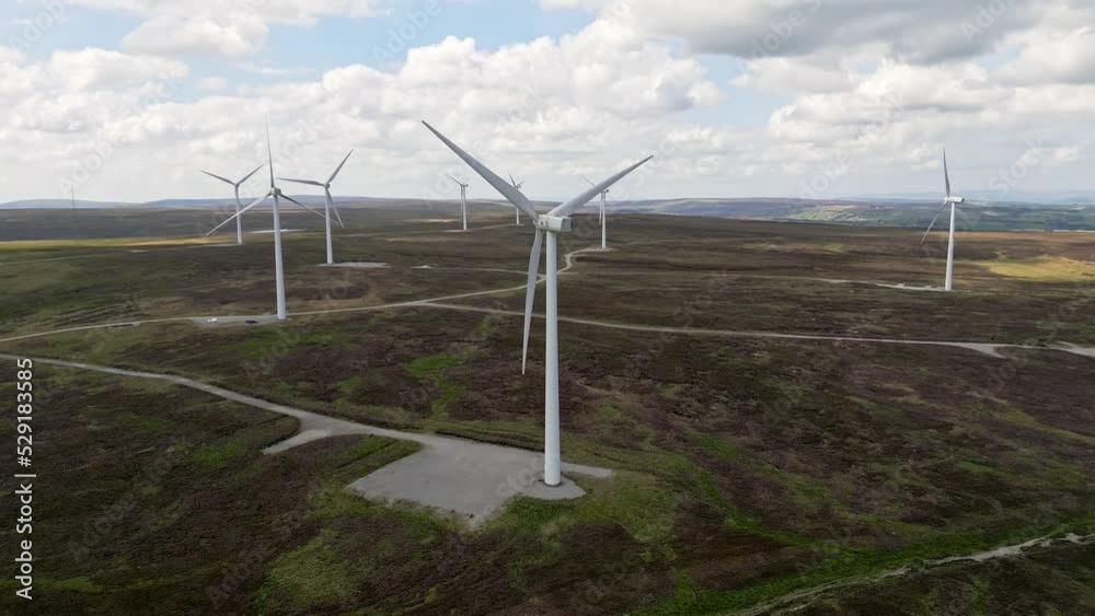Modern Wind Farm situated on the West Yorkshire Moors taken using a drone. Aerial view with wind turbines turning in the wind. Modern Wind Farm situated on the West Yorkshire Moors taken using a drone. Aerial view with wind turbines turning in the wind.