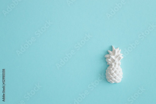 A plaster figure of a pineapple on a colored background