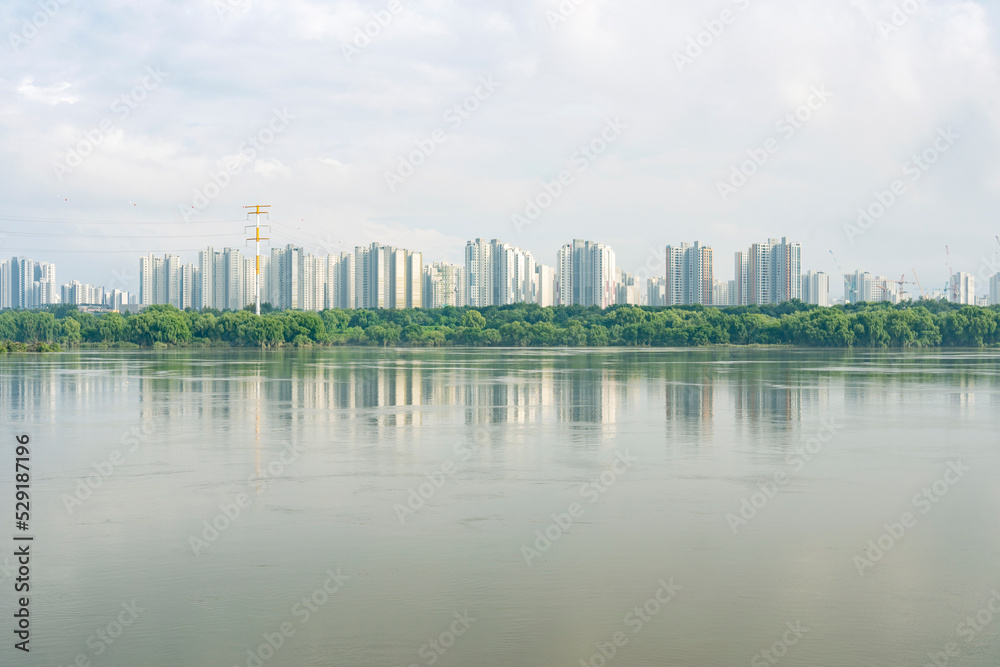 Buildings by the blue Han River in summer