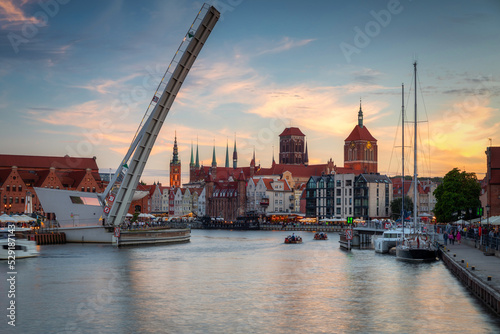Beautiful Gdansk city reflected in the Motlawa River at sunset. Poland