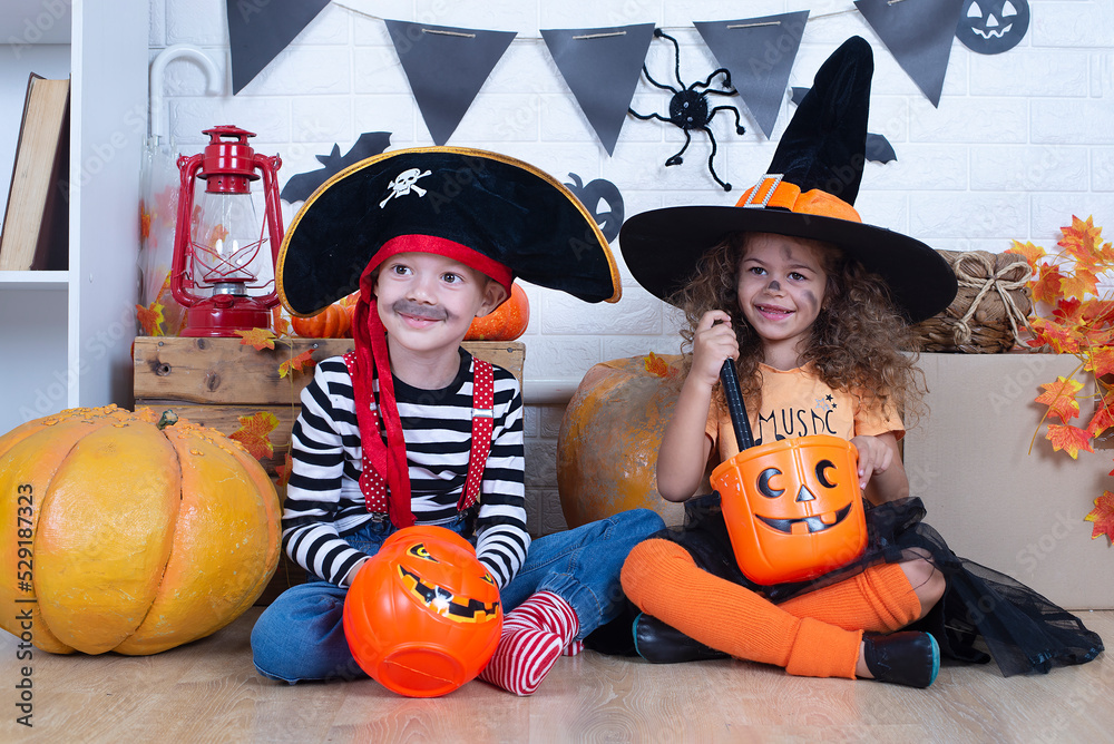 Fototapeta premium Children play with pumpkins. Holiday halloween