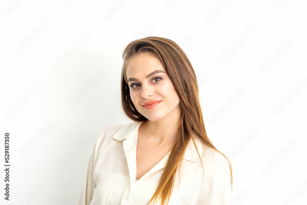 Portrait of a beautiful young caucasian smiling brunette woman on white background