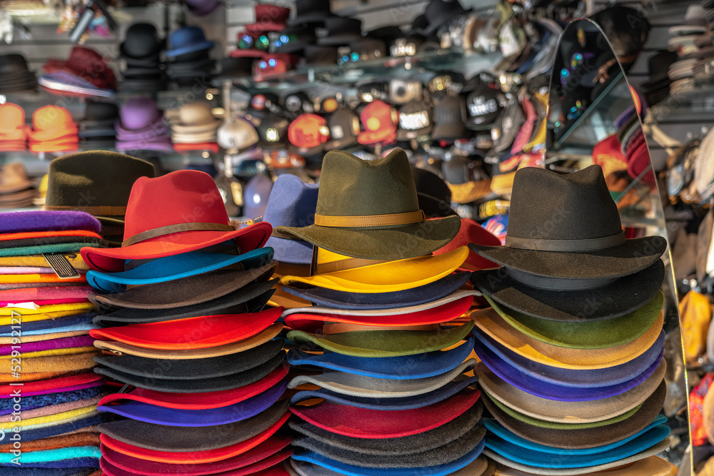 Colorful hats and caps on the market
