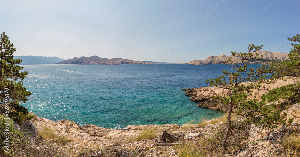 Beautiful seascape of rocky coast and clear waters of the Mediterranean Sea near Baska at the island of Krk, Croatia (Panorama)
