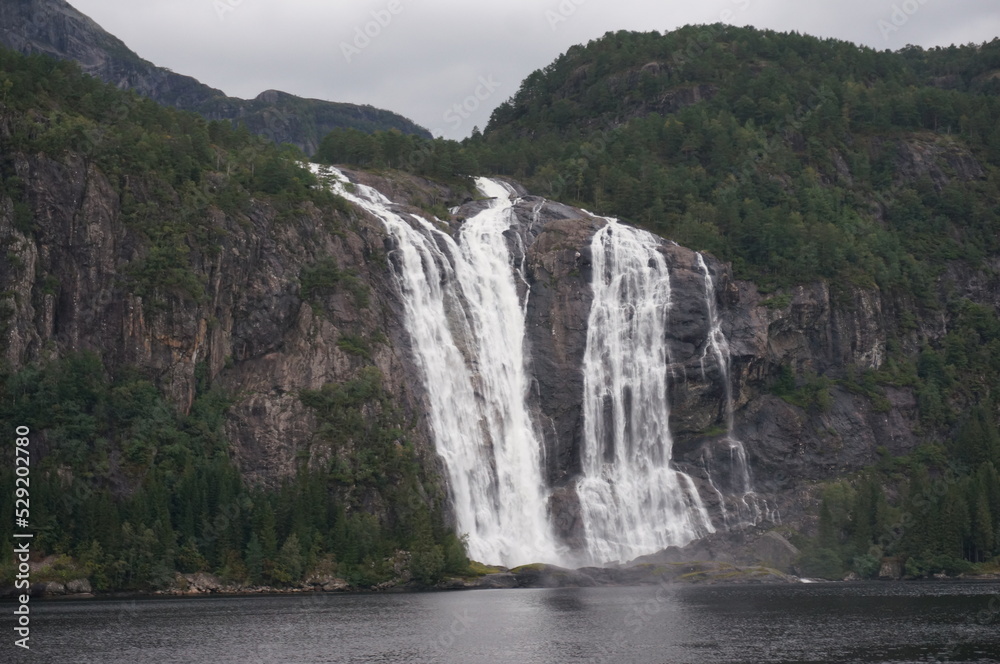 Waterfall. North shore of Dalsfjorden, fjord in Vestland county, Norway.