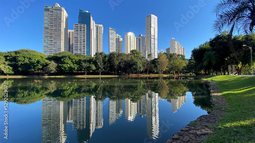 Reflection of modern bluindings in Areiao Park, downtown Goiania, Goias State, Brazil 