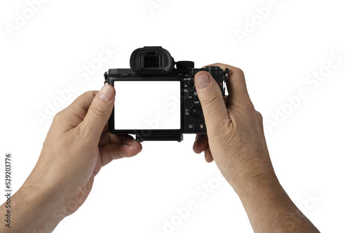 a man holds a mirrorless camera with his hands on a transparent background