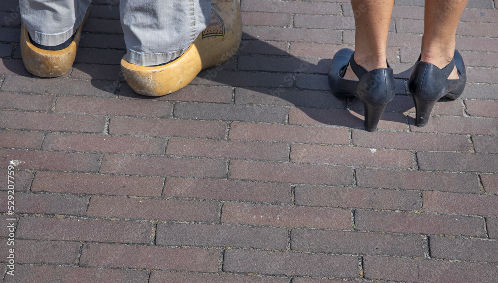 wooden shoes and ladies shoes, walking at street, city of elburg, gelderland, veluwe, netherlands, wooden shoes and ladies shoes, walking at street, city of elburg, gelderland, veluwe, netherlands,