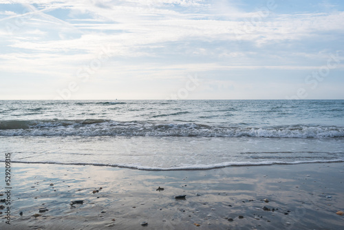 Seashore landscape. Summer holiday destination in Italy. Sandy beach in sunlight. © noxnorthy