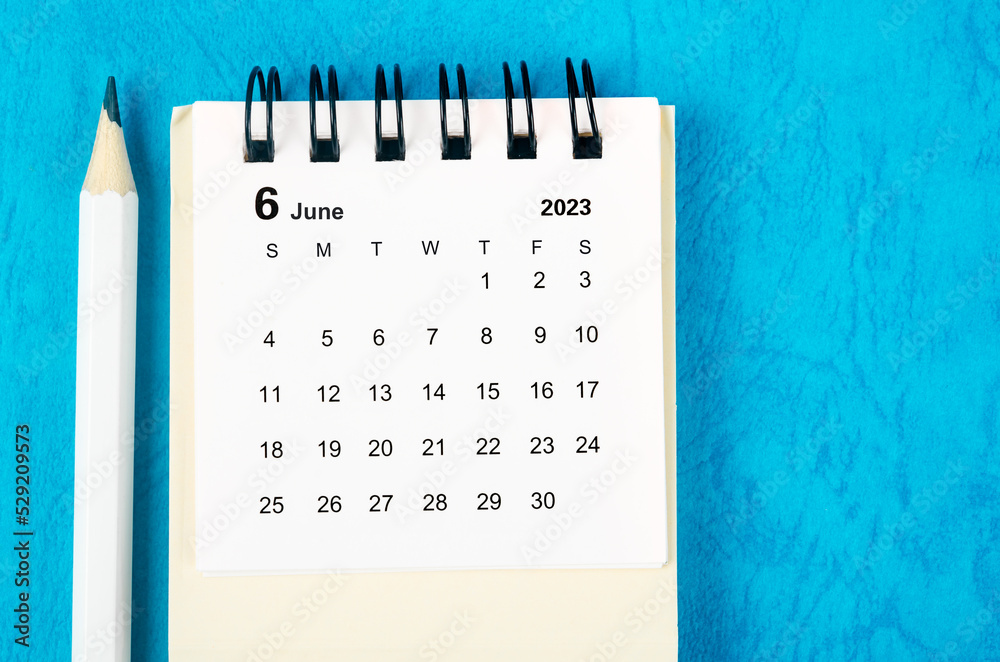 The June 2023 Monthly desk calendar for 2023 with pencil on blue  background. Stock Photo | Adobe Stock