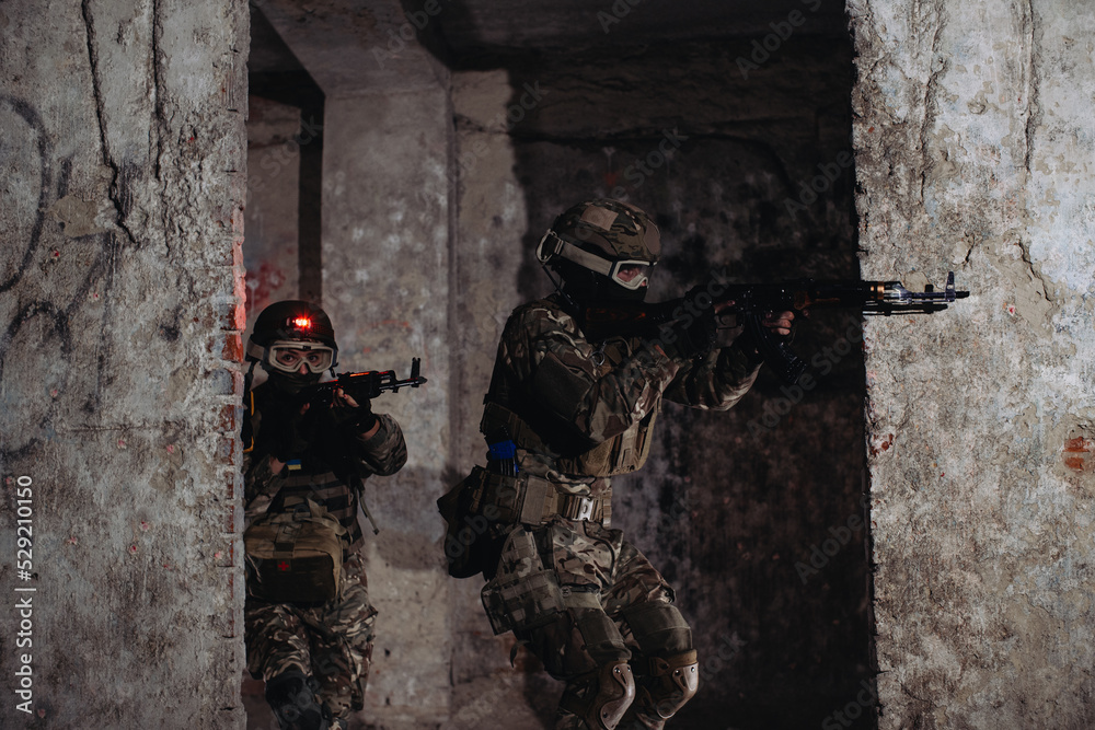Fototapeta premium Ukrainian soldiers on the battlefield. Special forces are conducting a combat operation.