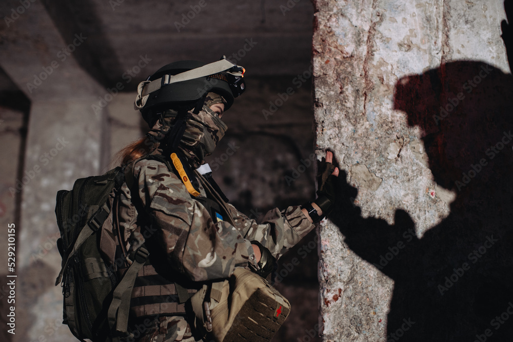Fototapeta premium A female soldier gives a high five to her brother in arms.