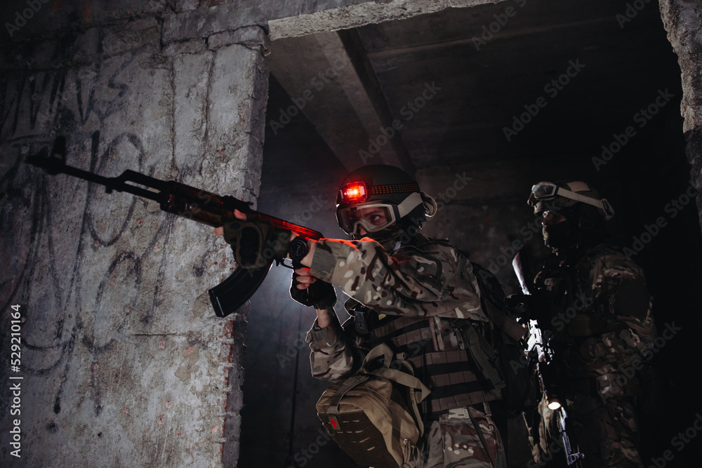 Fototapeta premium Ukrainian soldiers on the battlefield. Special forces conduct reconnaissance on enemy territory.