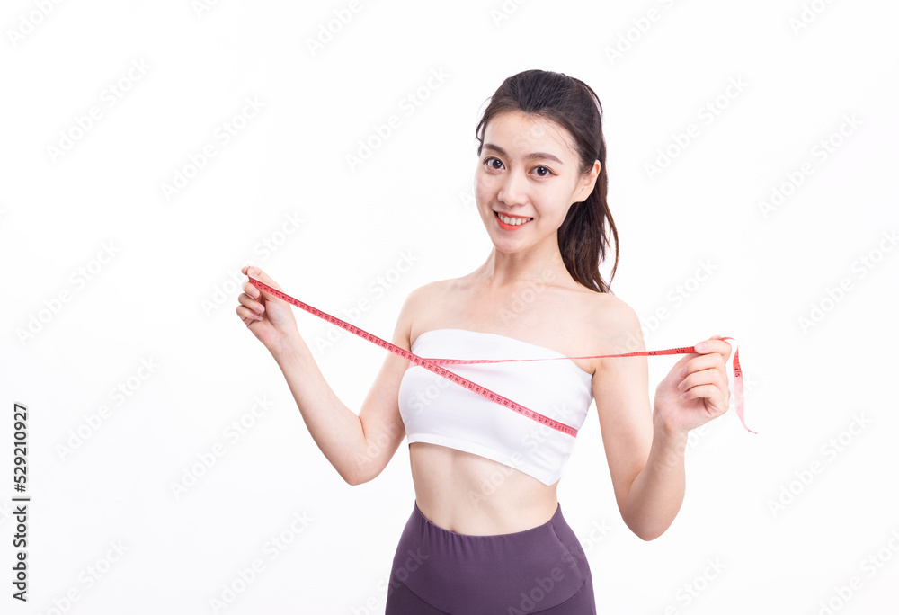 Attractive women in white sports underwear measure their breasts Attractive women in white sports underwear measure their breasts