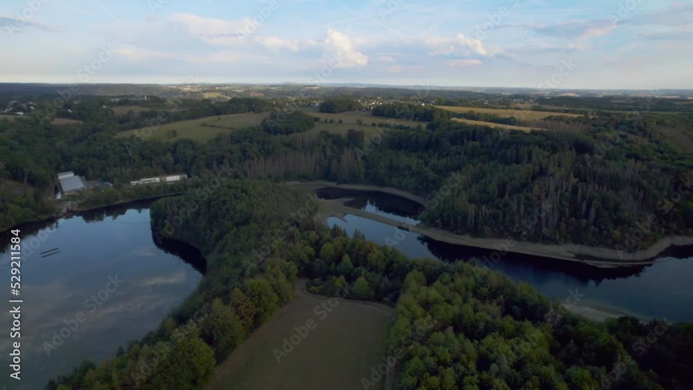 Aerial view of a water reservoir and a lush green forest in Germany, Europe Aerial view of a water reservoir and a lush green forest in Germany, Europe