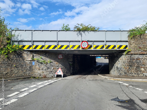 Low Bridge - hazard signs warning of a very low clearance height for vehicles. 