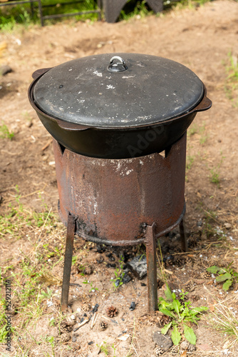 A cauldron for cooking outdoors. traditions of the east. cooking pilaf