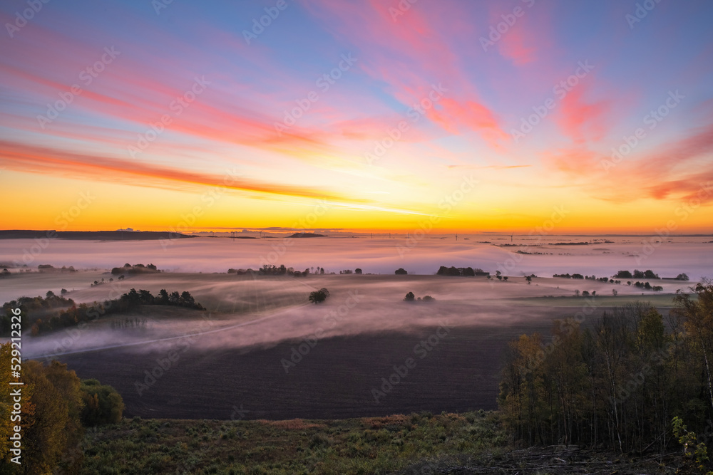Sunrise with fog in the landscape
