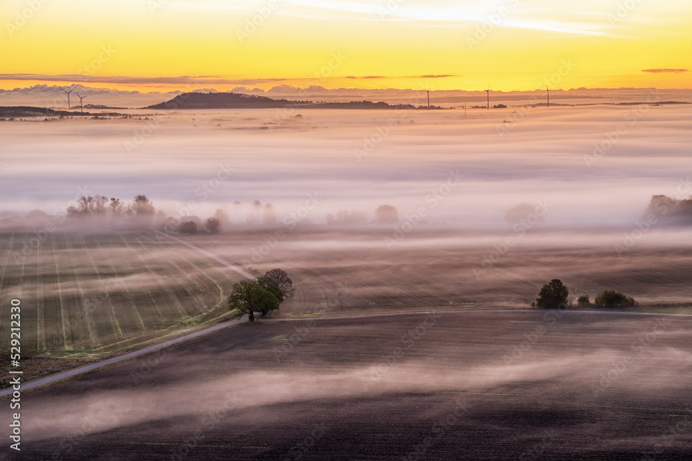 Fototapeta premium Sunrise with fog in the landscape