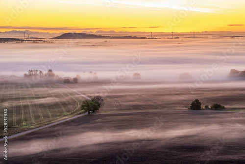 Sunrise with fog in the landscape