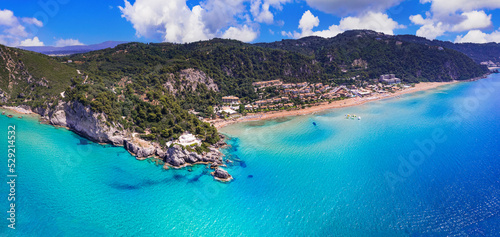 Fototapeta Naklejka Na Ścianę i Meble -  Greece summer holidays. Best scenic beaches of Corfu island - aerial panoramic view of Glyfada beach and village in western part