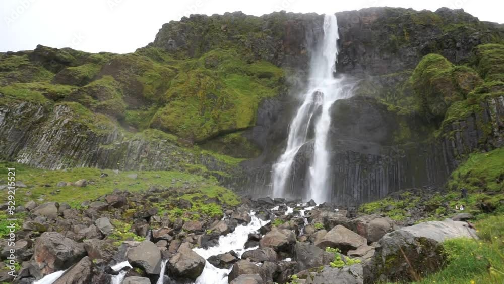 Bjarnarfoss waterfall and rock in Iceland