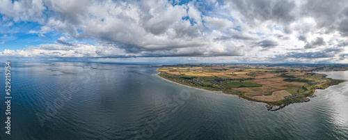 Aerial view above Bamburgh Castle Golf Club during summer