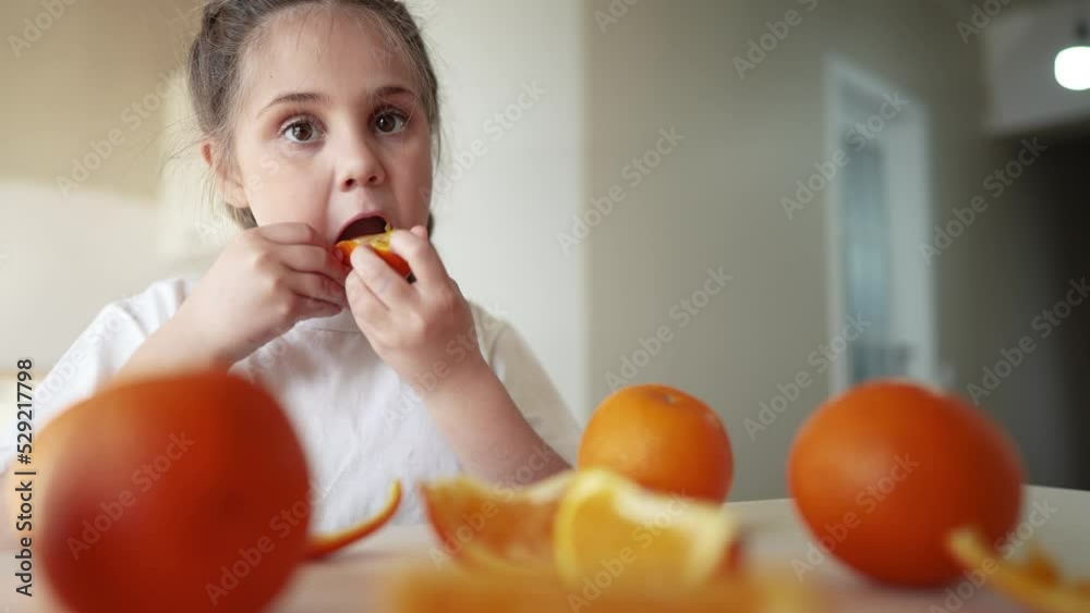 girl child eating oranges. dream happy family fruit healthy food kid