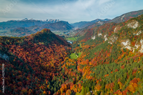 AERIAL  Beautiful view of alpine valley between mountains in vivid autumn shades