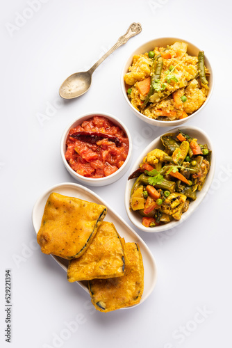 Bengali Bhog food for Indian Hindu Durga Puja or pooja festival. Khichadi, labra, tomato chutney