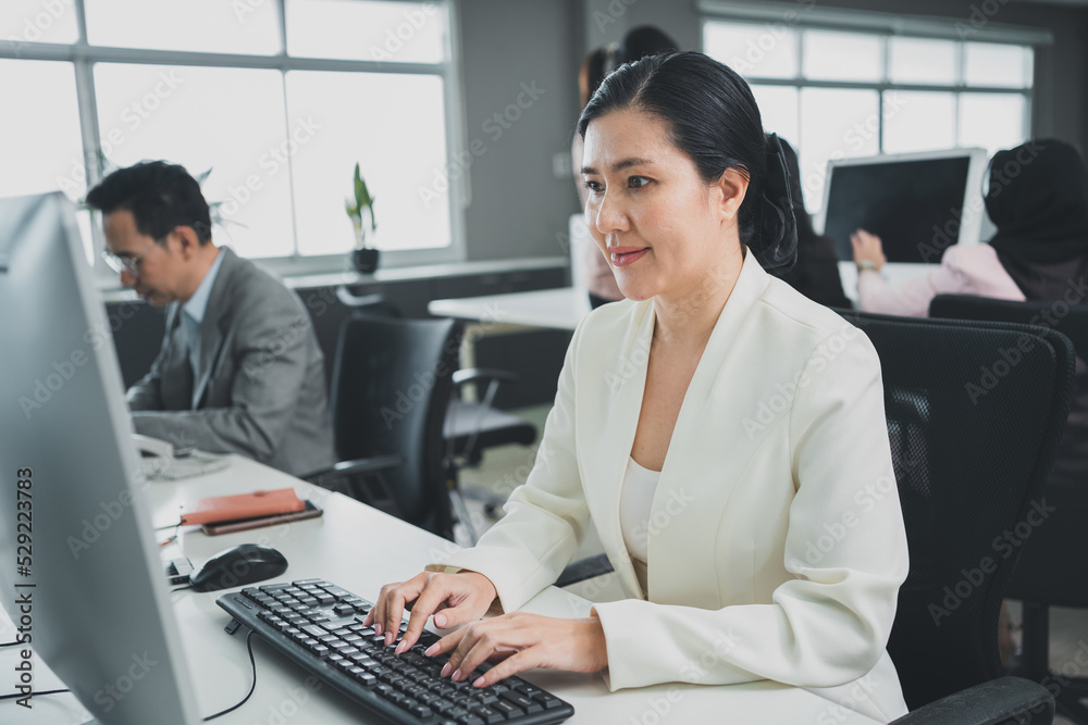 Asian business adult business business woman cooperation colleagues communication company computer meeting congratulations.Discussion of Japanese women executives working on laptops. Asian business adult business business woman cooperation colleagues communication company computer meeting congratulations.Discussion of Japanese women executives working on laptops.