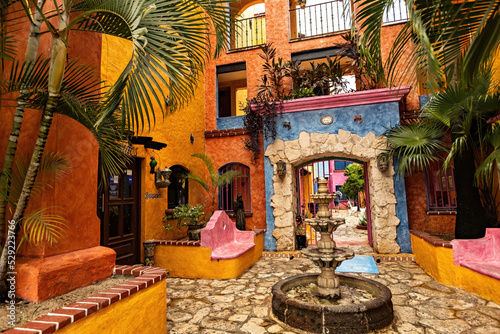 Fototapeta Naklejka Na Ścianę i Meble -  Traditional Mexican style colorful villa, house, hotel in Playa del Carmen, entrance view, Mexico