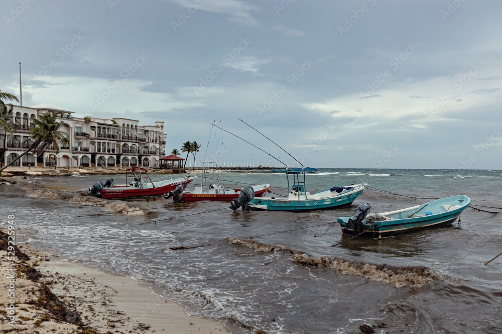 Boats on the water, stormy sea in Playa del Carmen, Mexico
